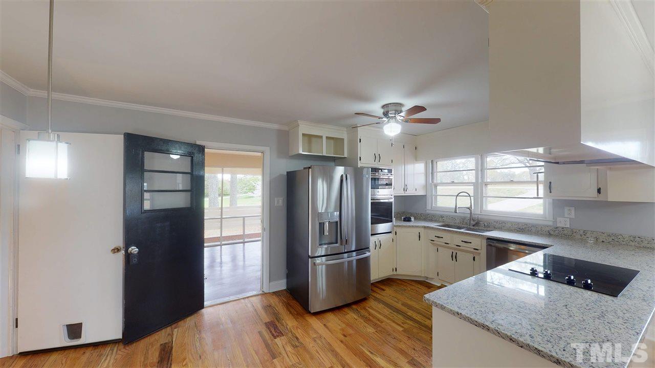 108 Rand Road Raleigh, NC 27603 - Photo 5 of 29 To the left under the light fixture is breakfast area. Photo does not show it well. Make an appointment to come check it out in person. To the right is the chef's delight kitchen.