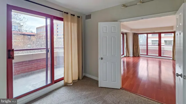 a view of front door with wooden floor