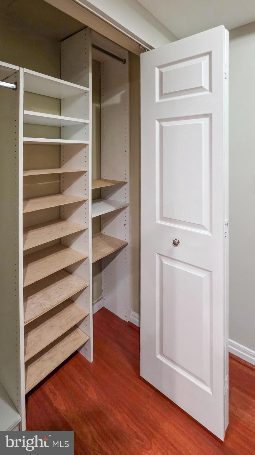 2301 N Street Northwest, Unit 404 Washington, DC 20037 - Photo 14 of 21 a view of walk in closet with empty racks
