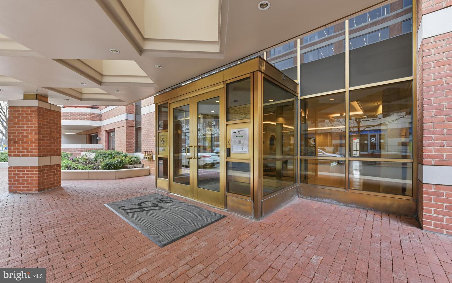 2301 N Street Northwest, Unit 404 Washington, DC 20037 - Photo 19 of 21 a view of an empty room with wooden floor and a window