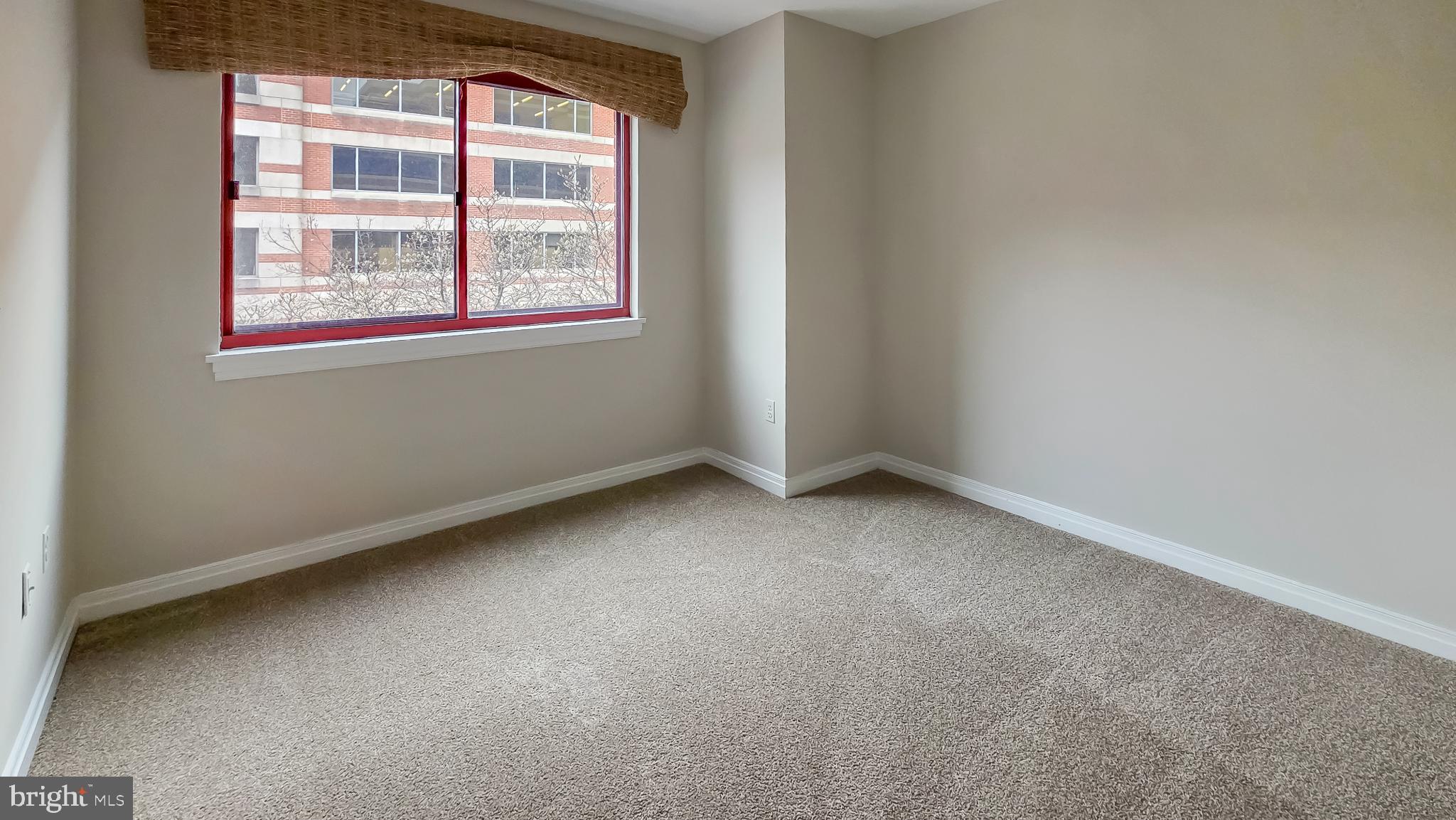 2301 N Street Northwest, Unit 404 Washington, DC 20037 - Photo 8 of 21 an empty room with a window