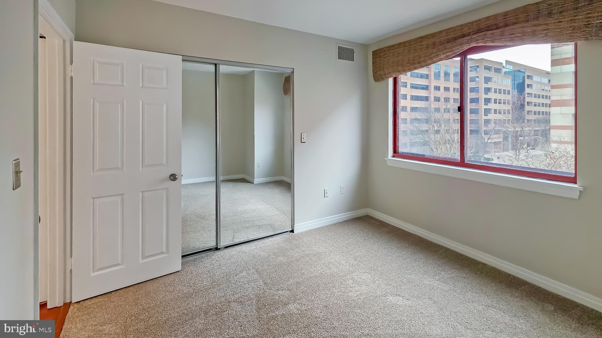 2301 N Street Northwest, Unit 404 Washington, DC 20037 - Photo 9 of 21 an empty room with windows