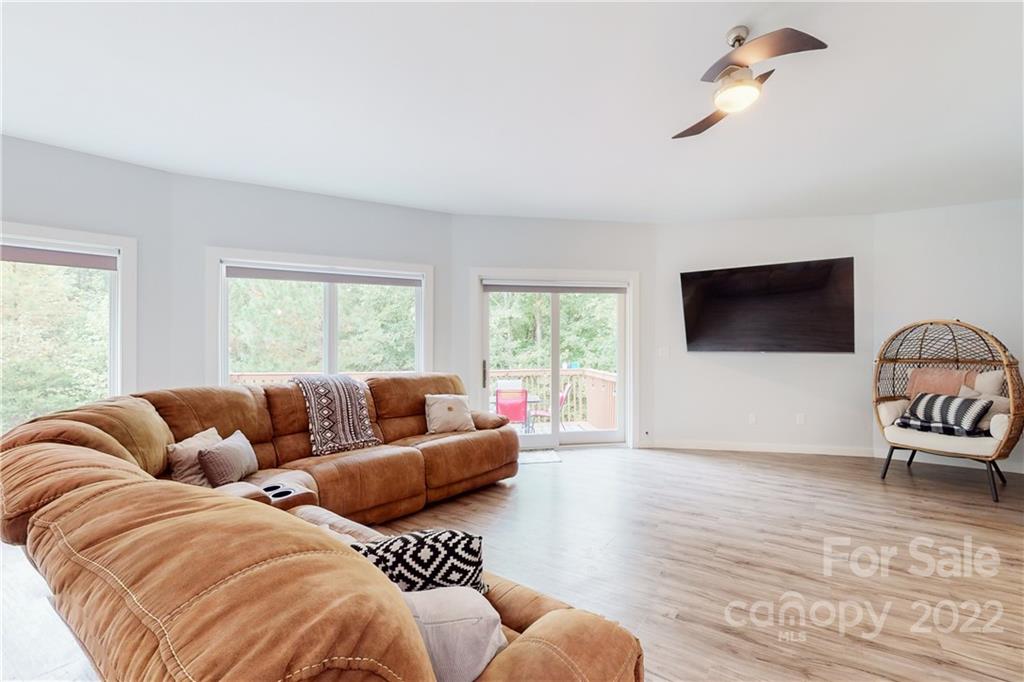 5386 Lockhart Road Sharon, SC 29742 - Photo 5 of 42 a living room with couches a flat screen tv and a large window