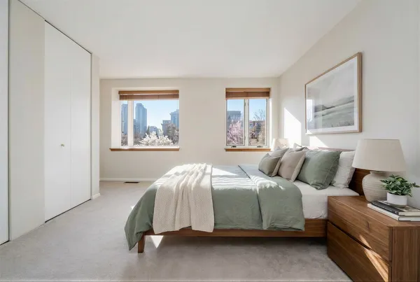 a bedroom with a bed and window