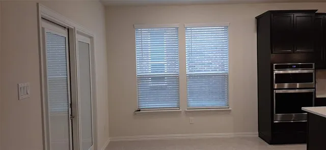 a view of a closet area with cabinets