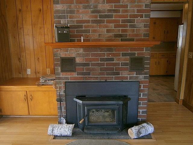393 Vassalboro Road China, ME 04358 - Photo 6 of 23 Living room wood burning stove