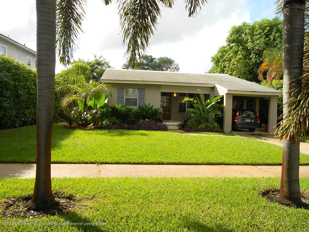 314 Westminster Road West Palm Beach, FL 33405 - Photo 1 of 9 a front view of a house with a garden and yard