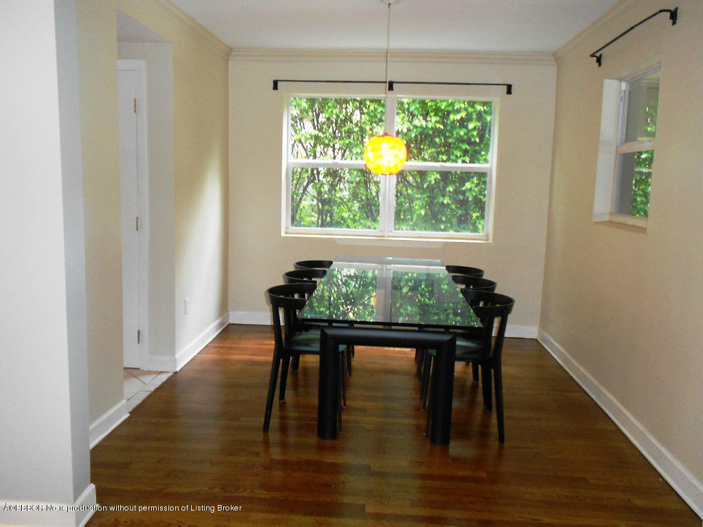 314 Westminster Road West Palm Beach, FL 33405 - Photo 3 of 9 a dining room with furniture window and wooden floor