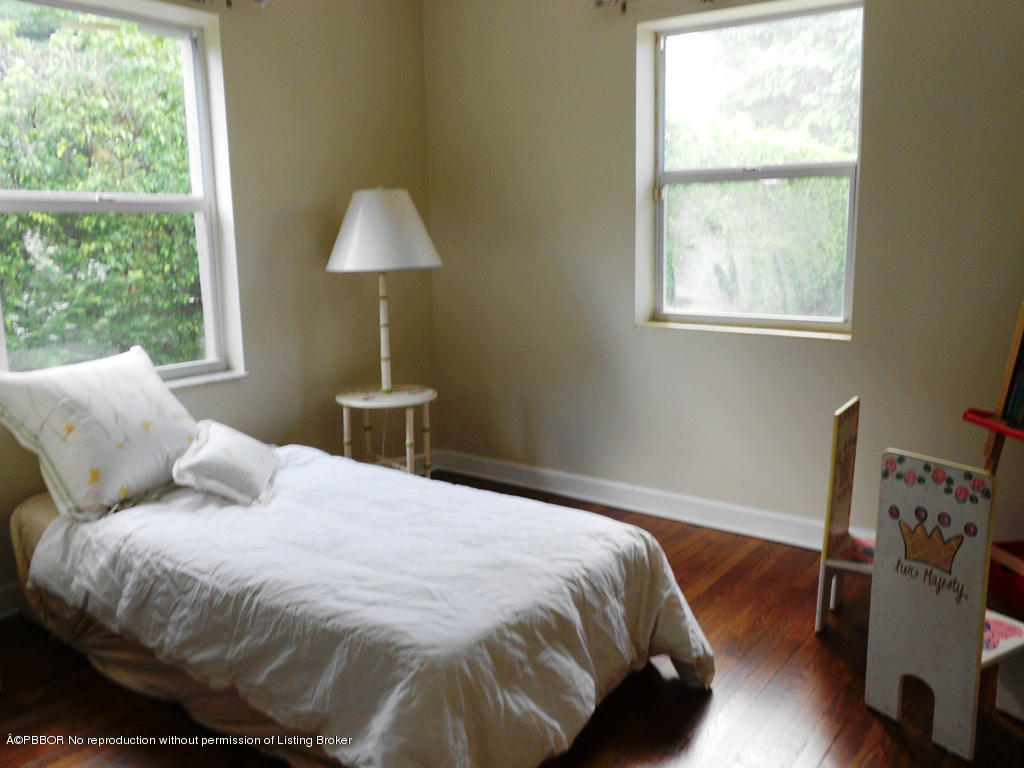 314 Westminster Road West Palm Beach, FL 33405 - Photo 5 of 9 a bedroom with a bed and a window