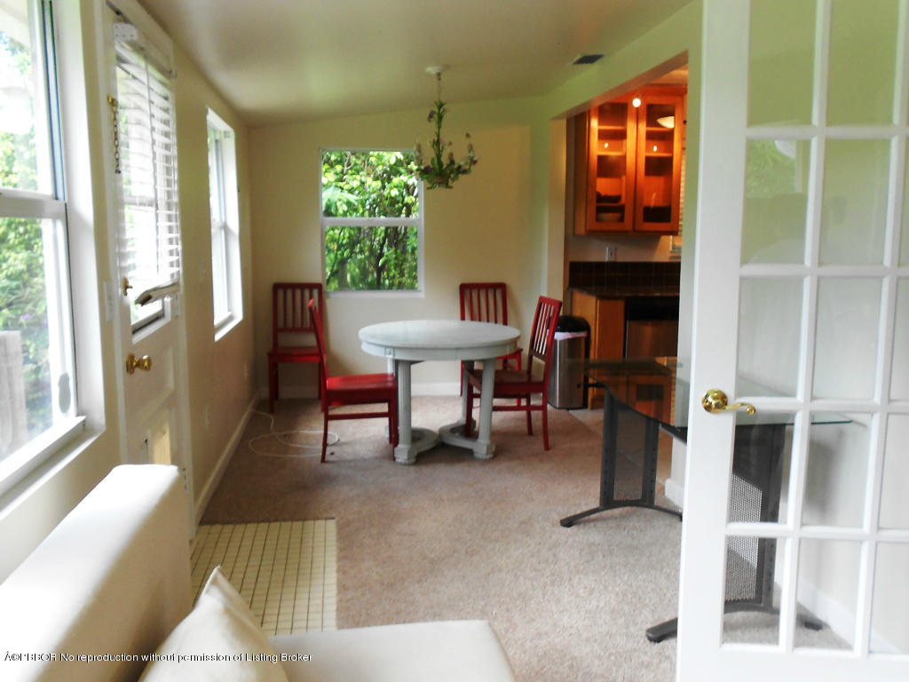 314 Westminster Road West Palm Beach, FL 33405 - Photo 7 of 9 a room with furniture and a large window