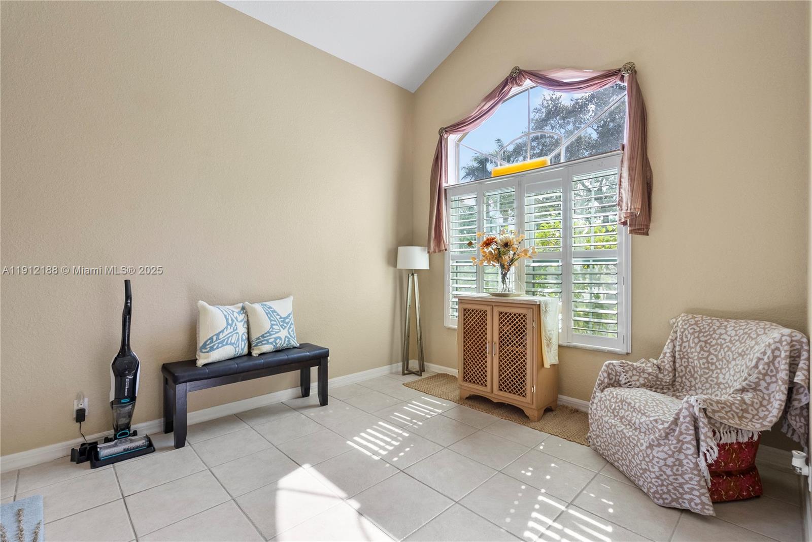 2795 Southeast Stonebriar Way Stuart, FL 34997 - Photo 14 of 54 a living room with furniture and a window