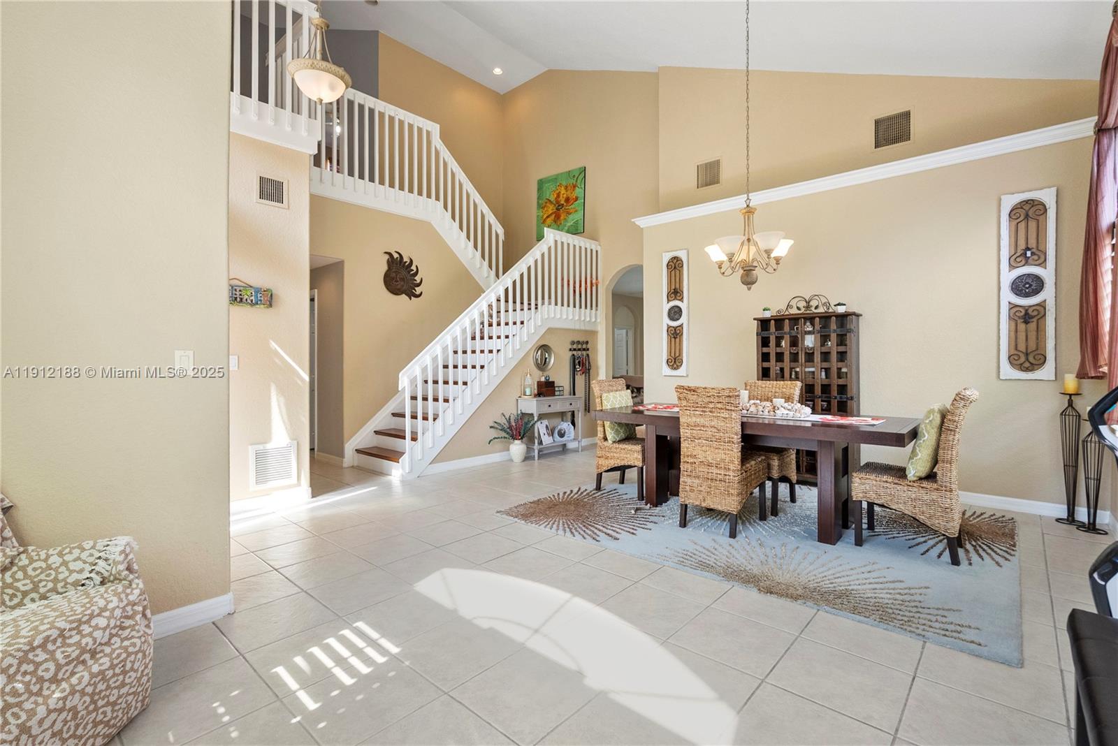 2795 Southeast Stonebriar Way Stuart, FL 34997 - Photo 15 of 54 a view of a living room and dining room
