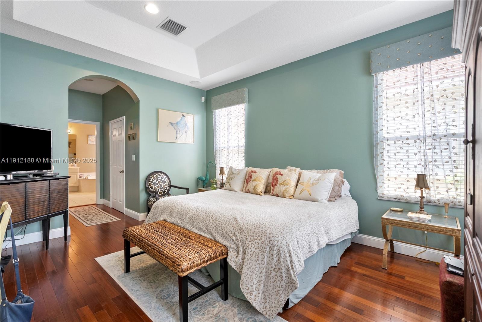 2795 Southeast Stonebriar Way Stuart, FL 34997 - Photo 19 of 54 a bedroom with a bed and a couch