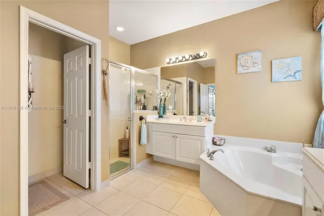 a bathroom with a sink a mirror and a bathtub