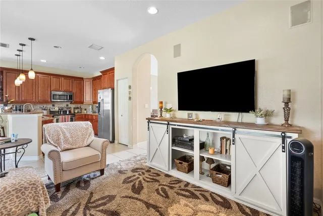 a bedroom with a bed and flat screen tv