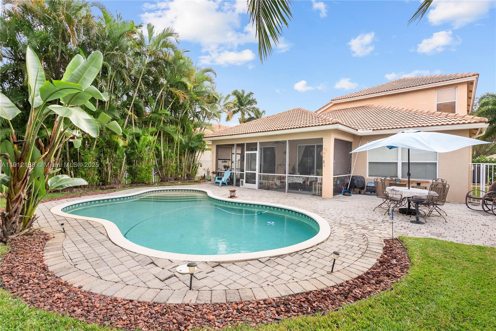 2795 Southeast Stonebriar Way Stuart, FL 34997 - Photo 40 of 54 a view of a house with swimming pool and sitting area