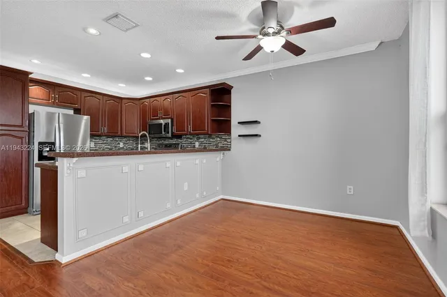 a view of a kitchen with a sink and cabinet area