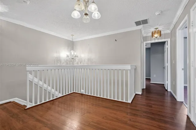 a bathroom with a bathtub double vanity sink and a mirror
