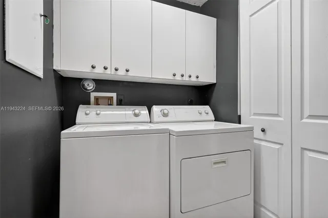 an empty room with a window and wooden floor