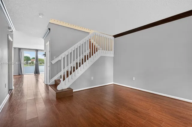 front view of a house with potted plants