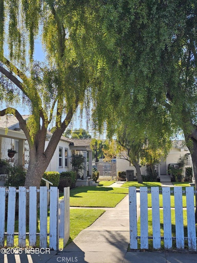 304 East Fesler Street Santa Maria, CA 93454 - Photo 4 of 7 a view of a house with a yard and furniture