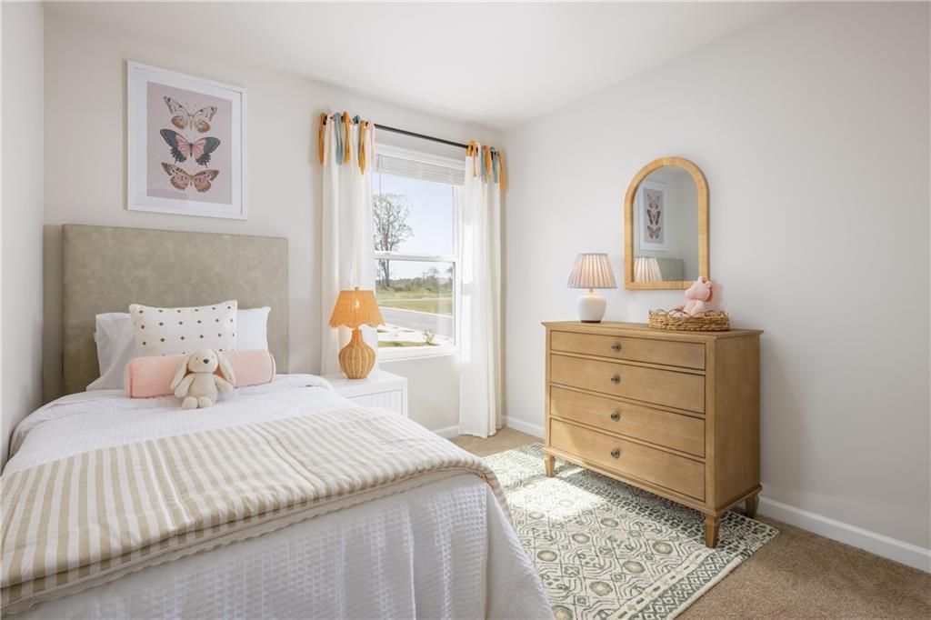 4809 Orchard Grove Way, Unit 182 Gainesville, GA 30504 - Photo 12 of 18 a bedroom with a bed and a painting on the wall