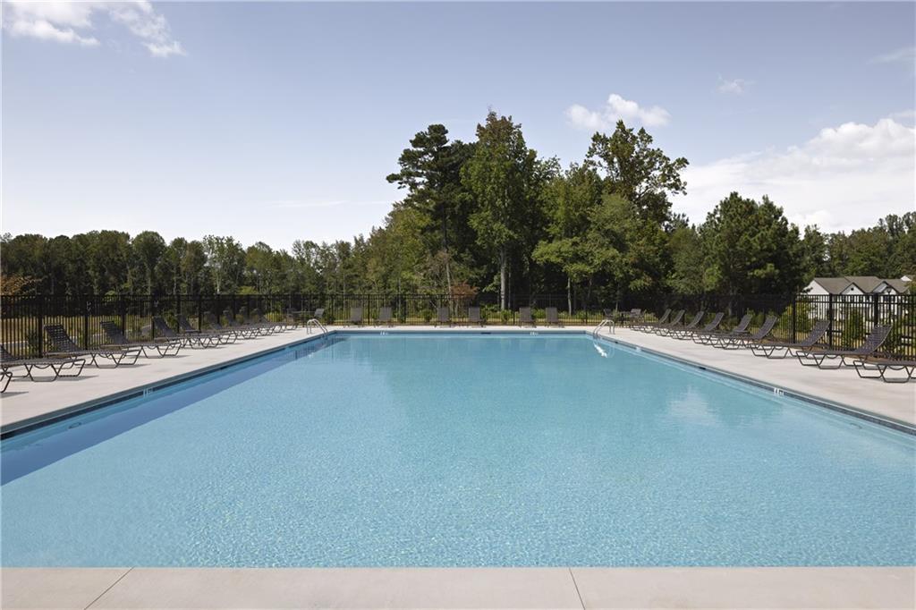 4809 Orchard Grove Way, Unit 182 Gainesville, GA 30504 - Photo 18 of 18 a view of a swimming pool and a yard