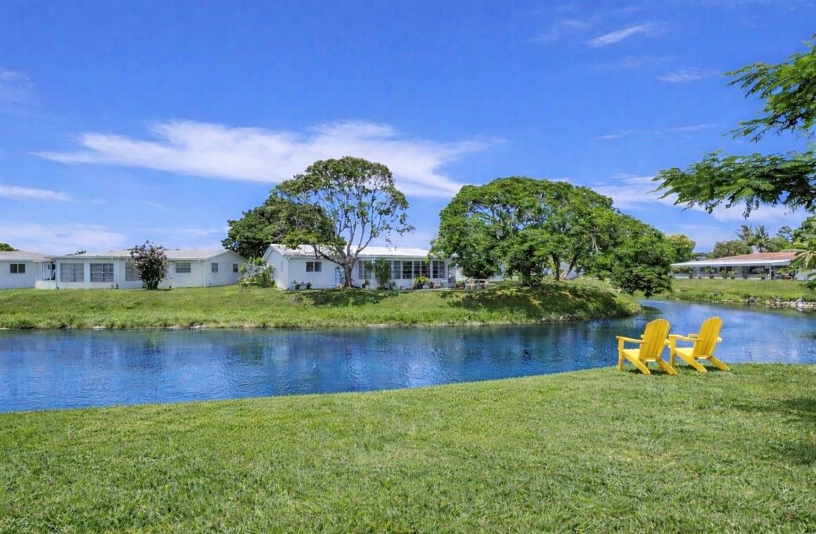 6755 Northwest 15th Street Margate, FL 33063 - Photo 2 of 11 a view of a lake with a house in the background