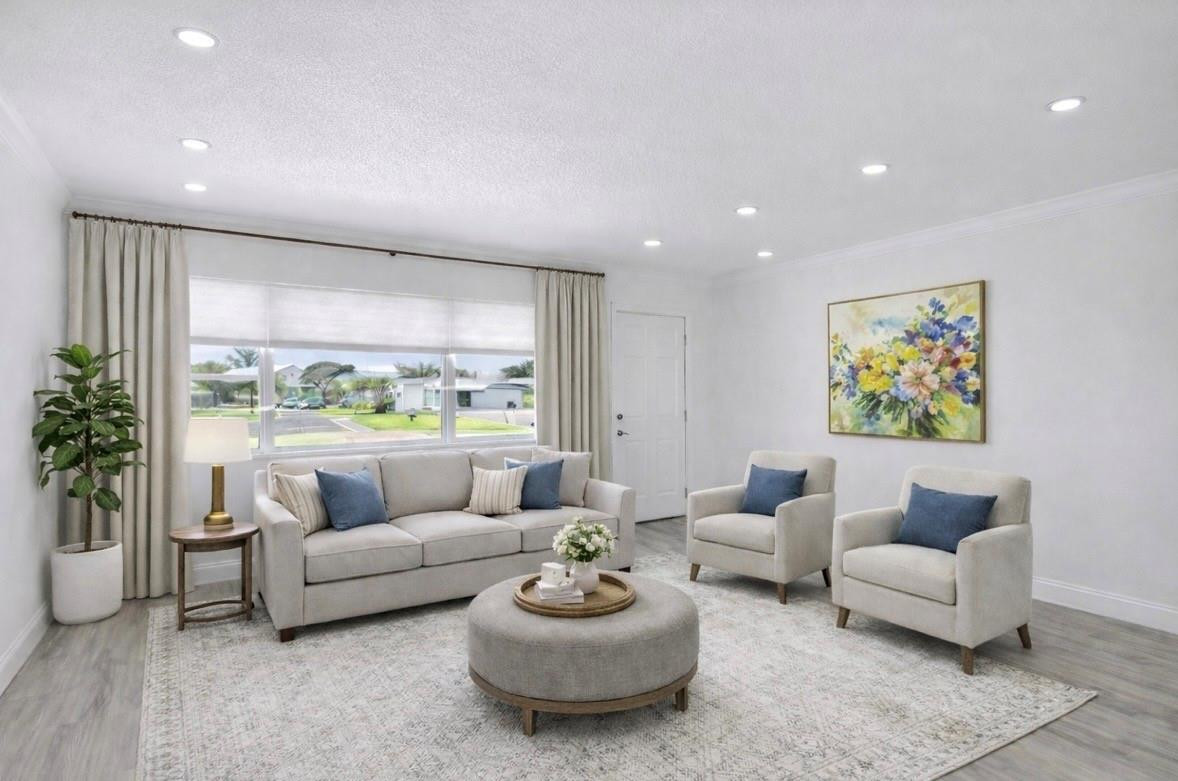 6755 Northwest 15th Street Margate, FL 33063 - Photo 4 of 11 a living room with furniture and a large window