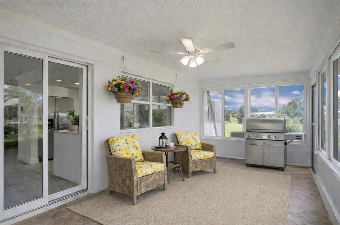 6755 Northwest 15th Street Margate, FL 33063 - Photo 7 of 11 a living room with furniture and a kitchen