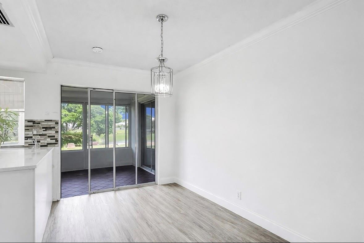 6755 Northwest 15th Street Margate, FL 33063 - Photo 8 of 11 a view of a room with wooden floor and a window