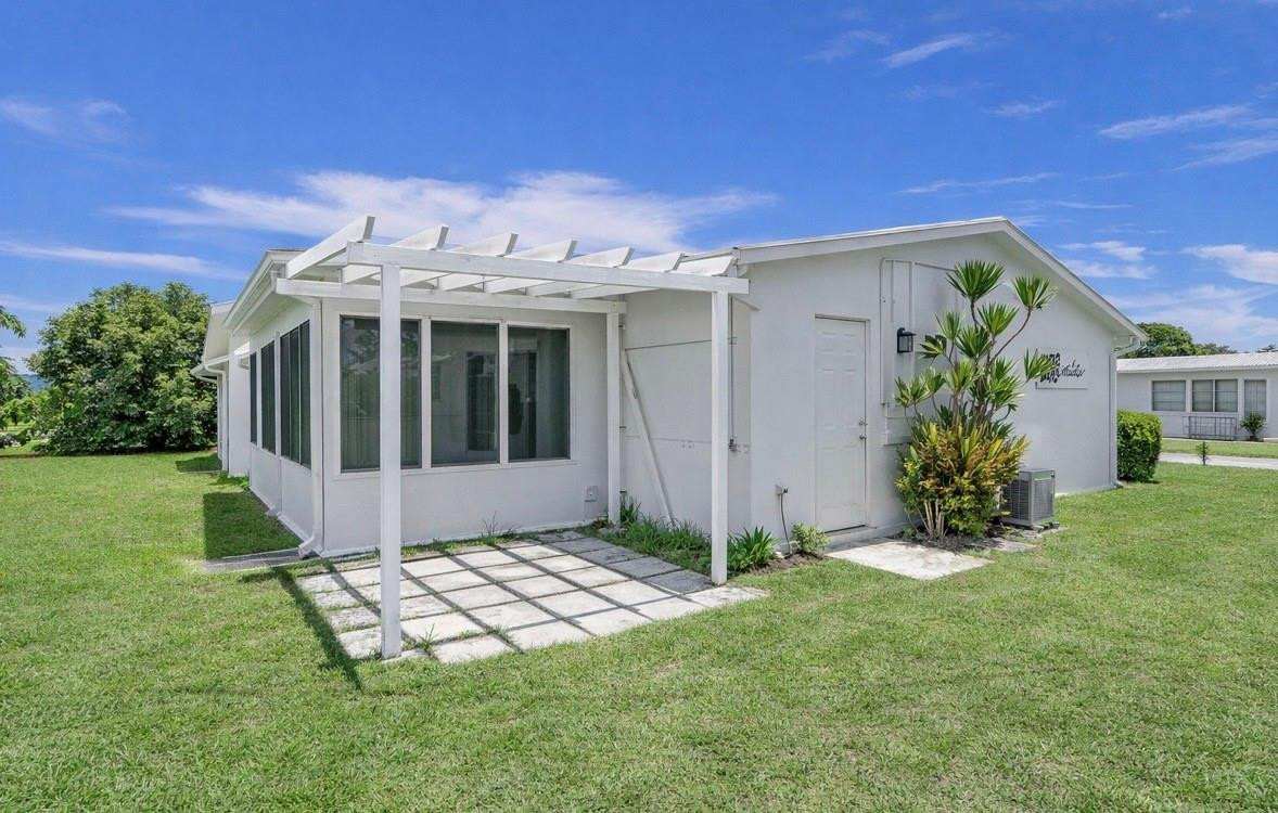 6755 Northwest 15th Street Margate, FL 33063 - Photo 10 of 11 a view of a porch with a yard
