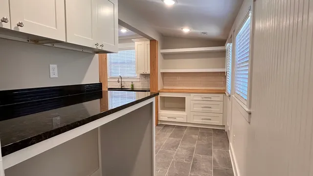 a bathroom with a shower and a sink