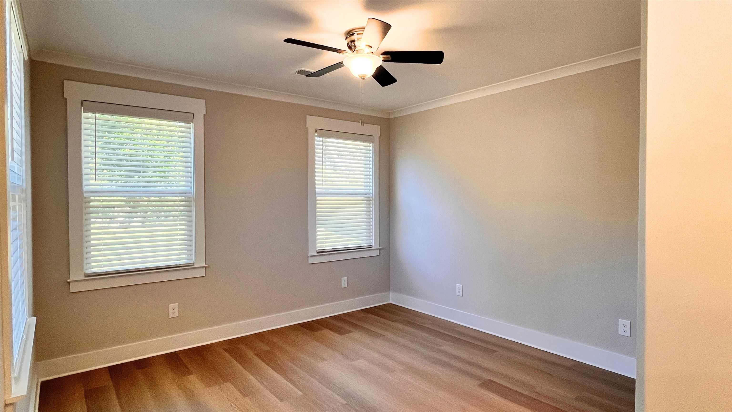 406 South Fenwick Road Memphis, TN 38111 - Photo 13 of 23 a view of an empty room with a window and wooden floor