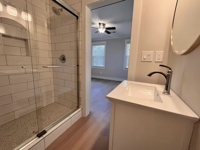an empty room with wooden floor and closet