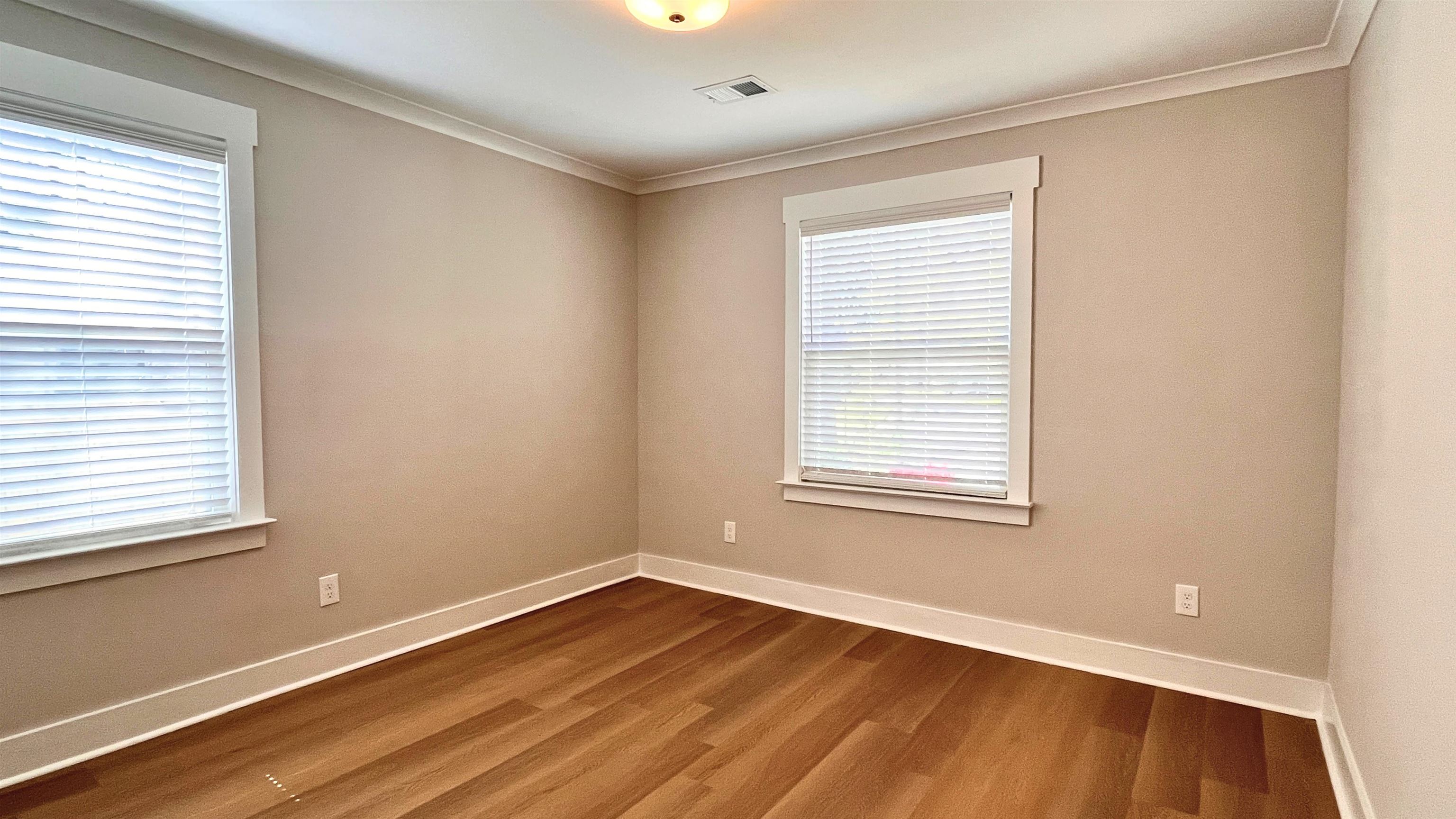 406 South Fenwick Road Memphis, TN 38111 - Photo 17 of 23 a view of an empty room with wooden floor and a window