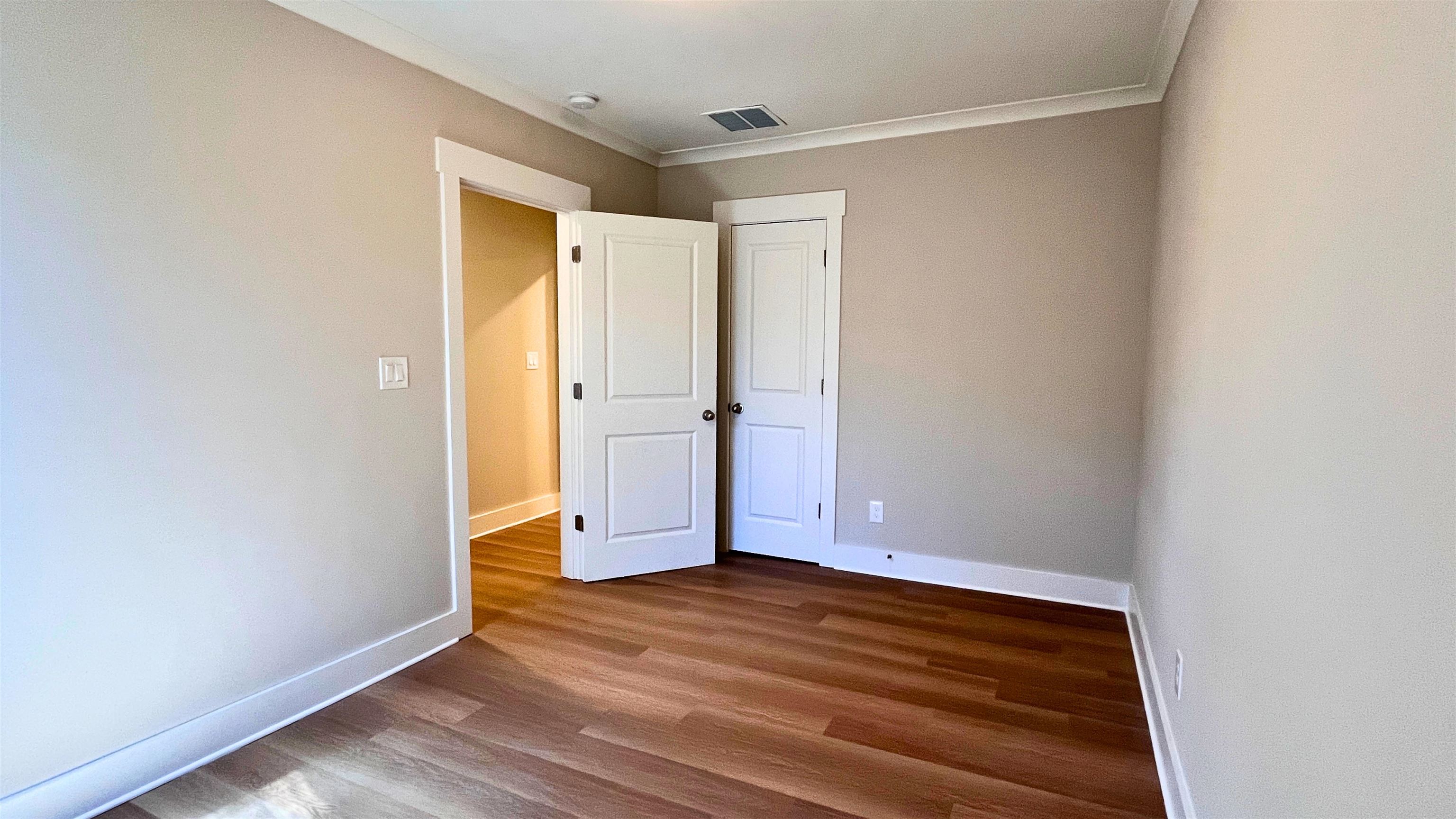 406 South Fenwick Road Memphis, TN 38111 - Photo 20 of 23 an empty room with wooden floor and closet