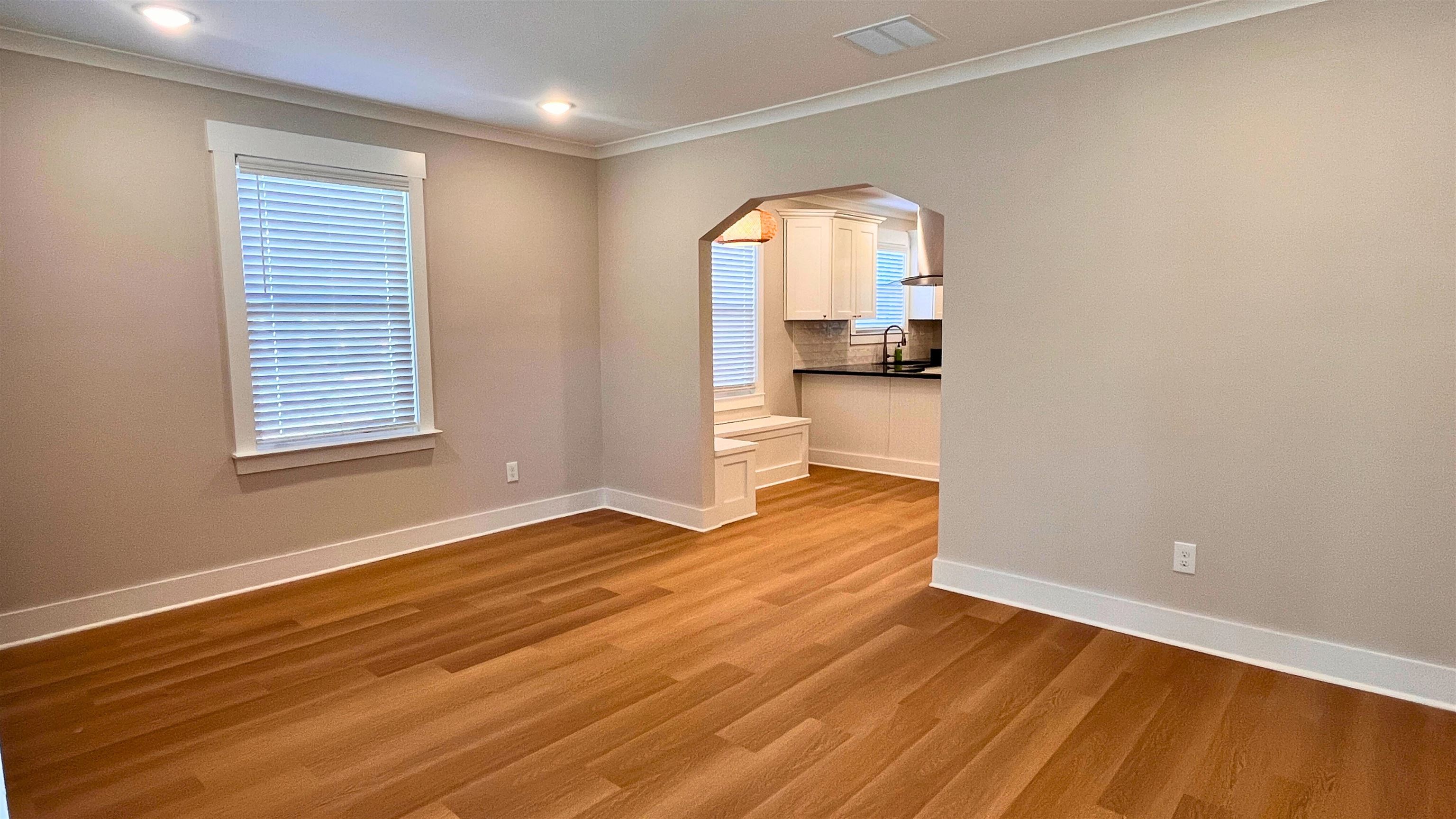 406 South Fenwick Road Memphis, TN 38111 - Photo 7 of 23 a view of empty room with wooden floor and fan