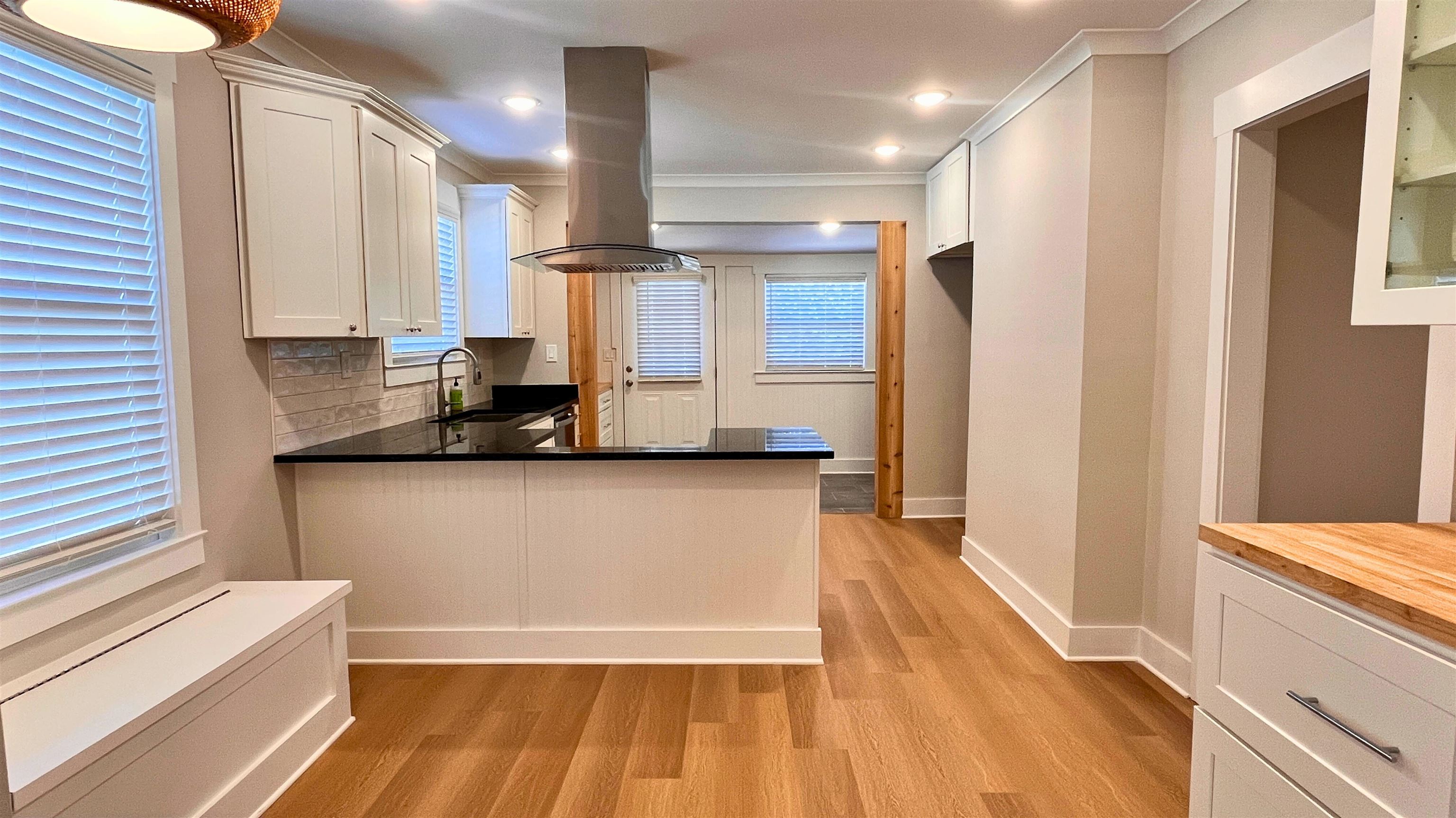 406 South Fenwick Road Memphis, TN 38111 - Photo 8 of 23 a view of a kitchen with wooden floor and a window