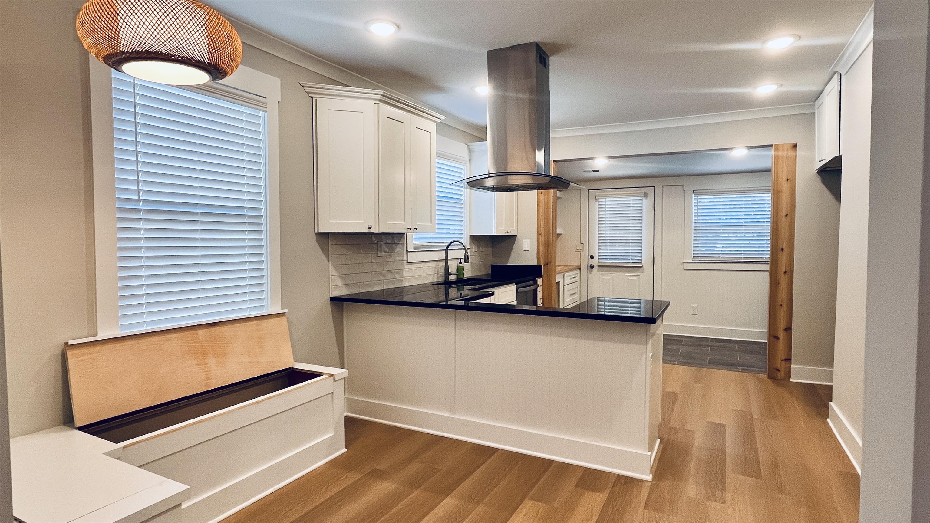 406 South Fenwick Road Memphis, TN 38111 - Photo 10 of 23 a kitchen with stainless steel appliances a refrigerator and wooden floor