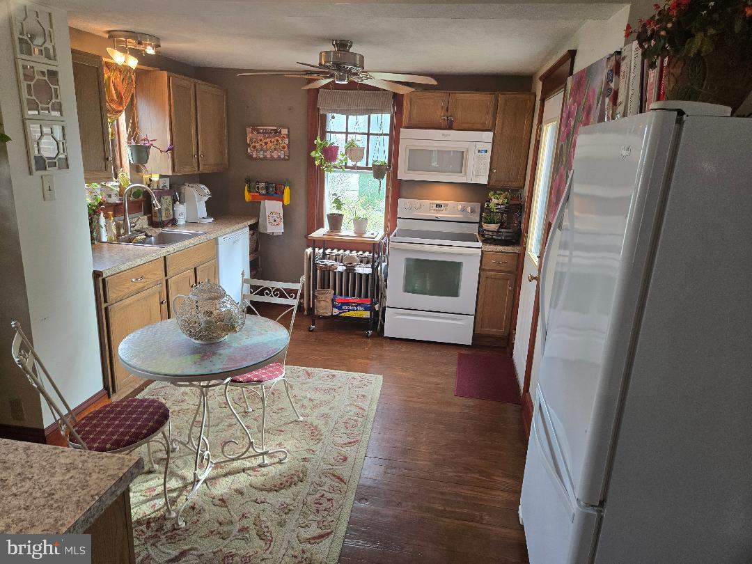 201 South Barbara Street Mount Joy, PA 17552 - Photo 5 of 13 a kitchen with stainless steel appliances a refrigerator a sink a stove a table and chairs