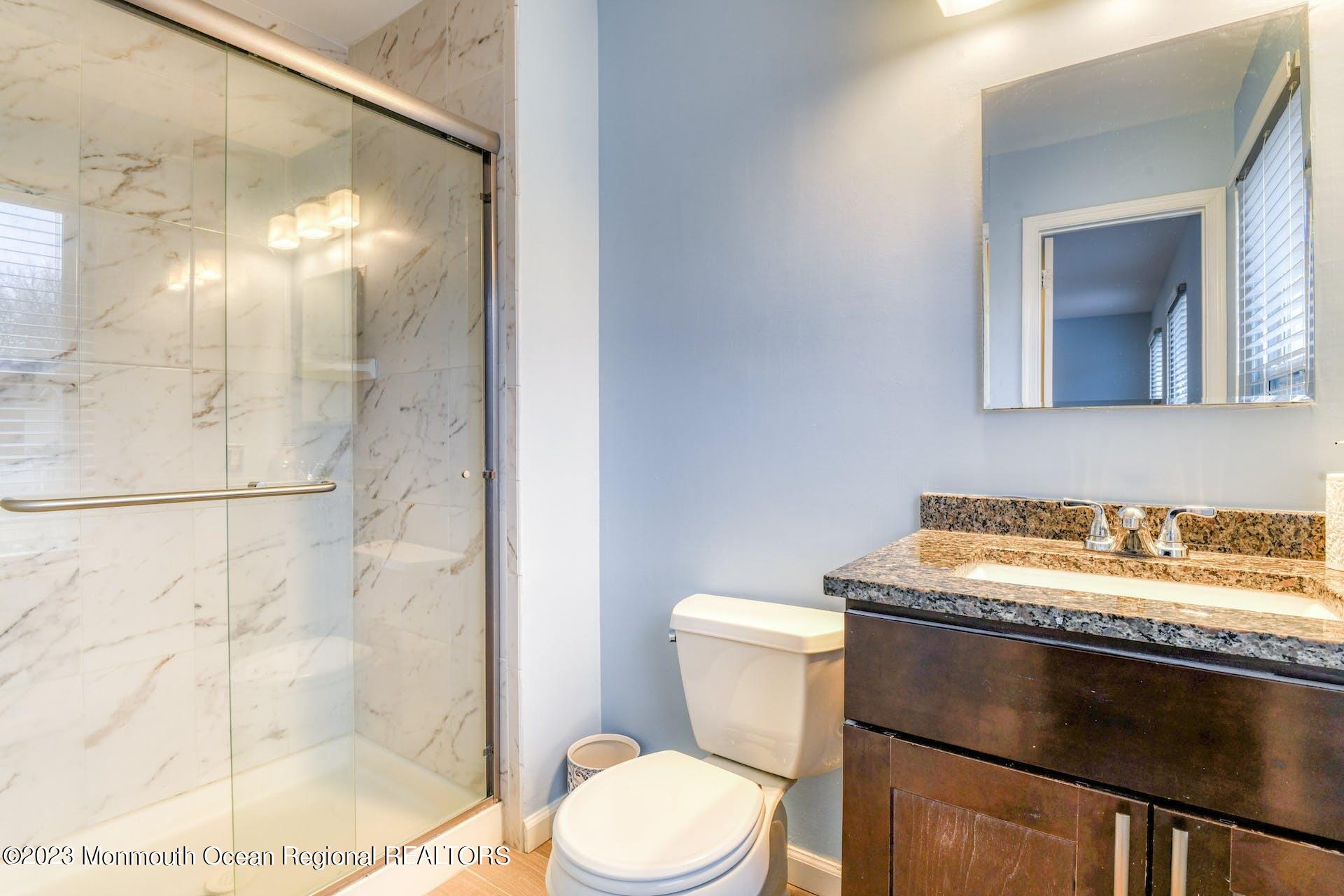 98 Starlight Road Howell, NJ 07731 - Photo 17 of 31 a bathroom with a sink and a mirror