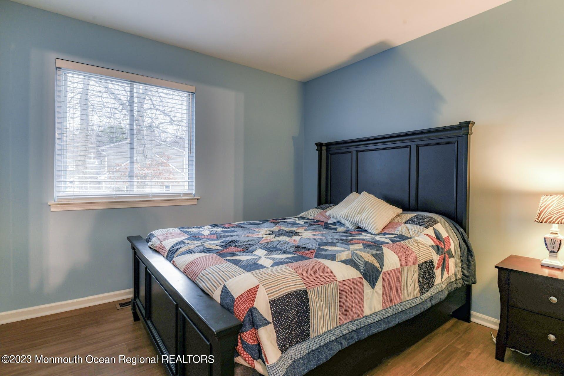98 Starlight Road Howell, NJ 07731 - Photo 18 of 31 a bedroom with a bed and a window
