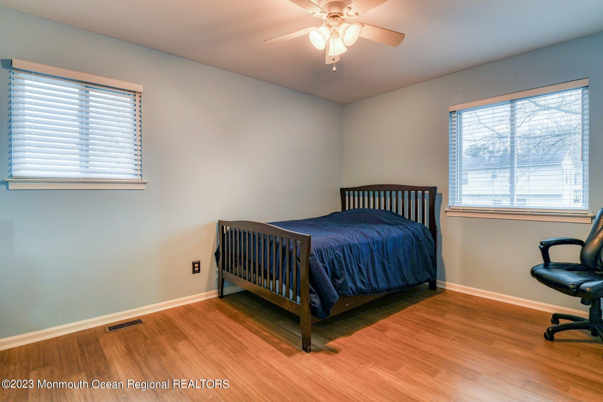 98 Starlight Road Howell, NJ 07731 - Photo 19 of 31 a spacious bedroom with a bed and a window