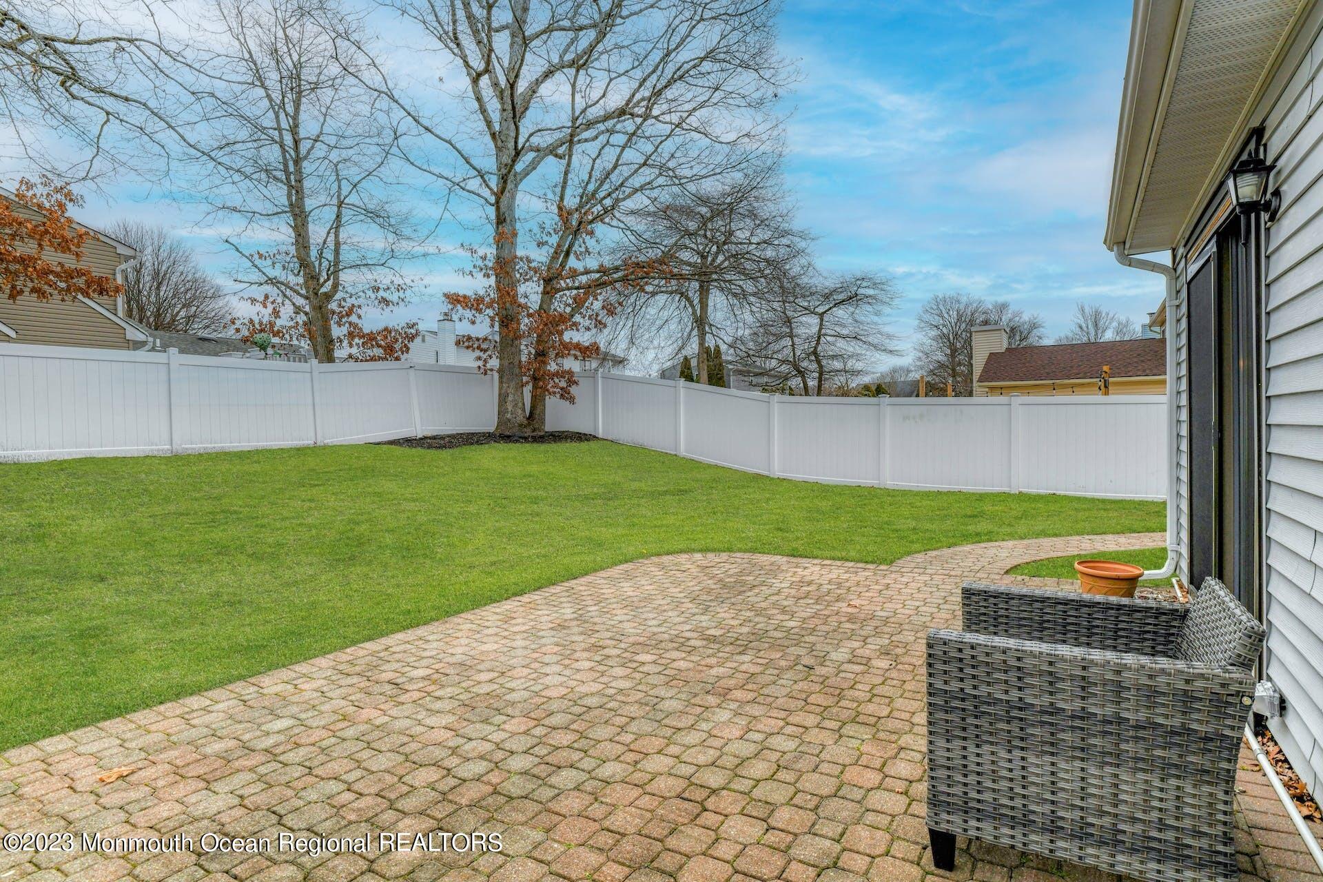 98 Starlight Road Howell, NJ 07731 - Photo 27 of 31 a view of a backyard with a garden