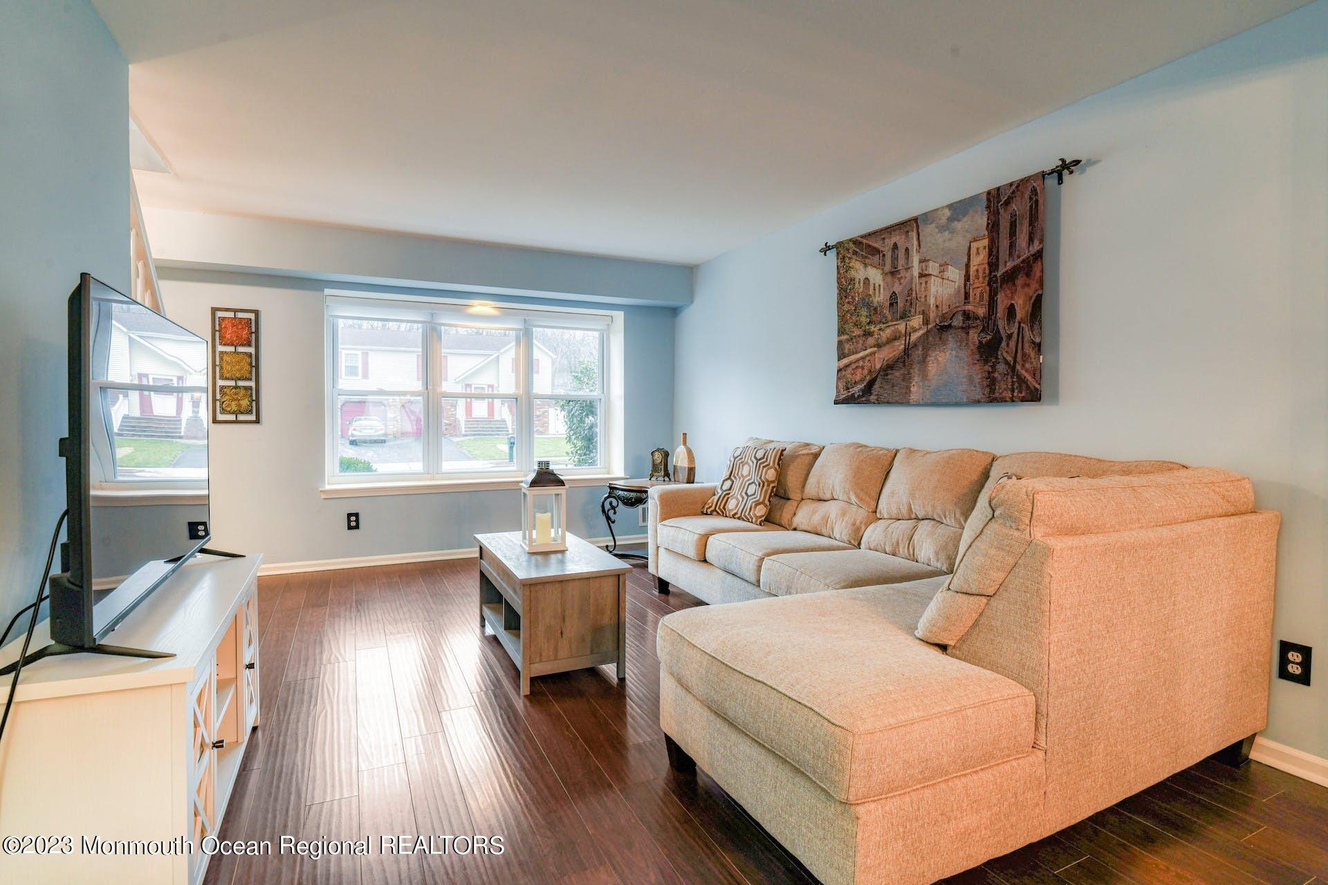 98 Starlight Road Howell, NJ 07731 - Photo 6 of 31 a living room with furniture and a large window