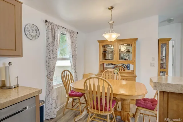 a dining room with furniture and window