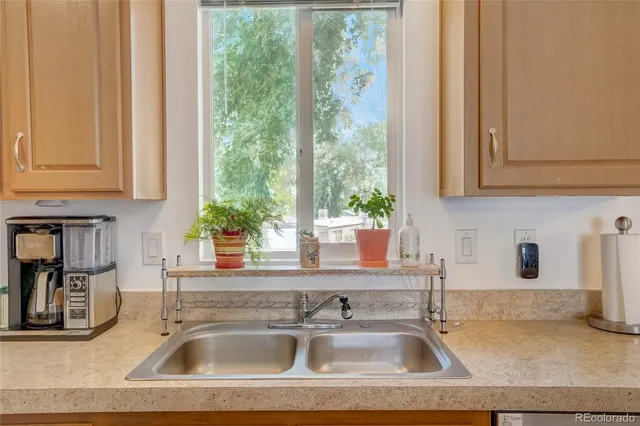 a kitchen with a sink and a window