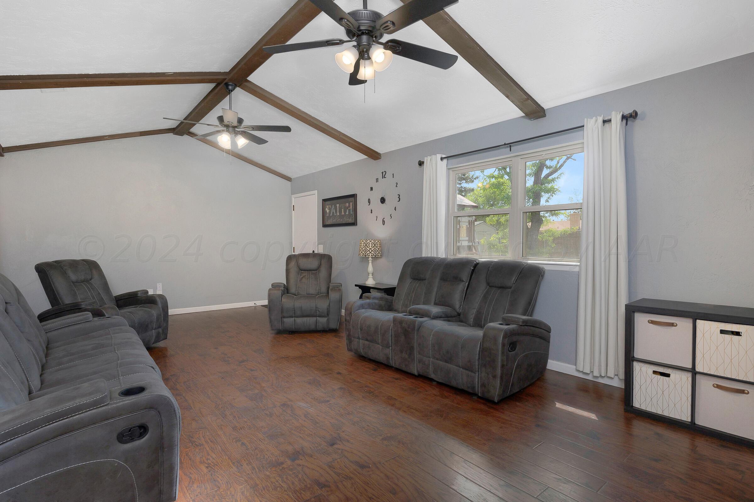 8116 Coronado Trail Amarillo, TX 79110 - Photo 4 of 18 a living room with furniture and a window