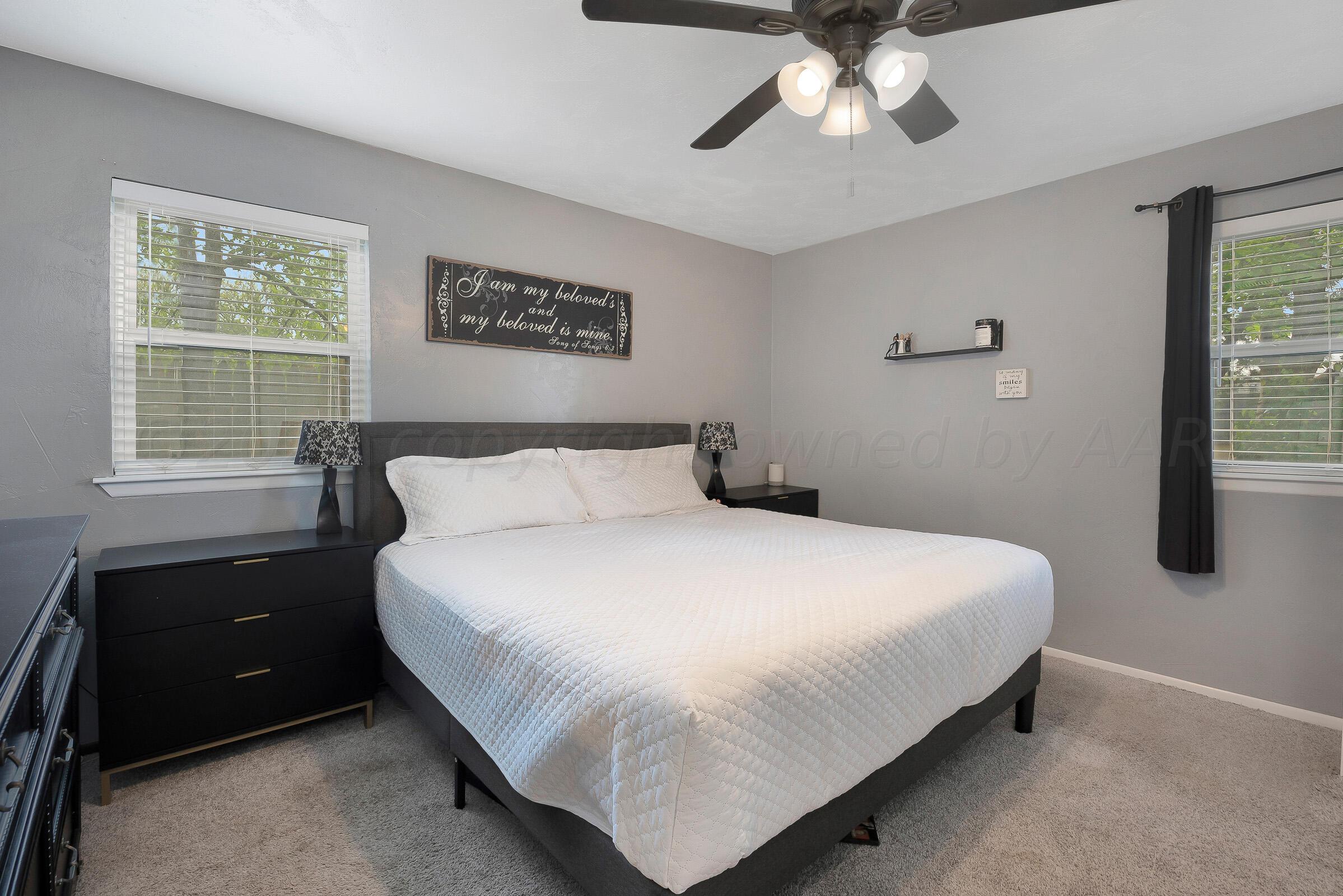 8116 Coronado Trail Amarillo, TX 79110 - Photo 10 of 18 a bedroom with a bed and a window